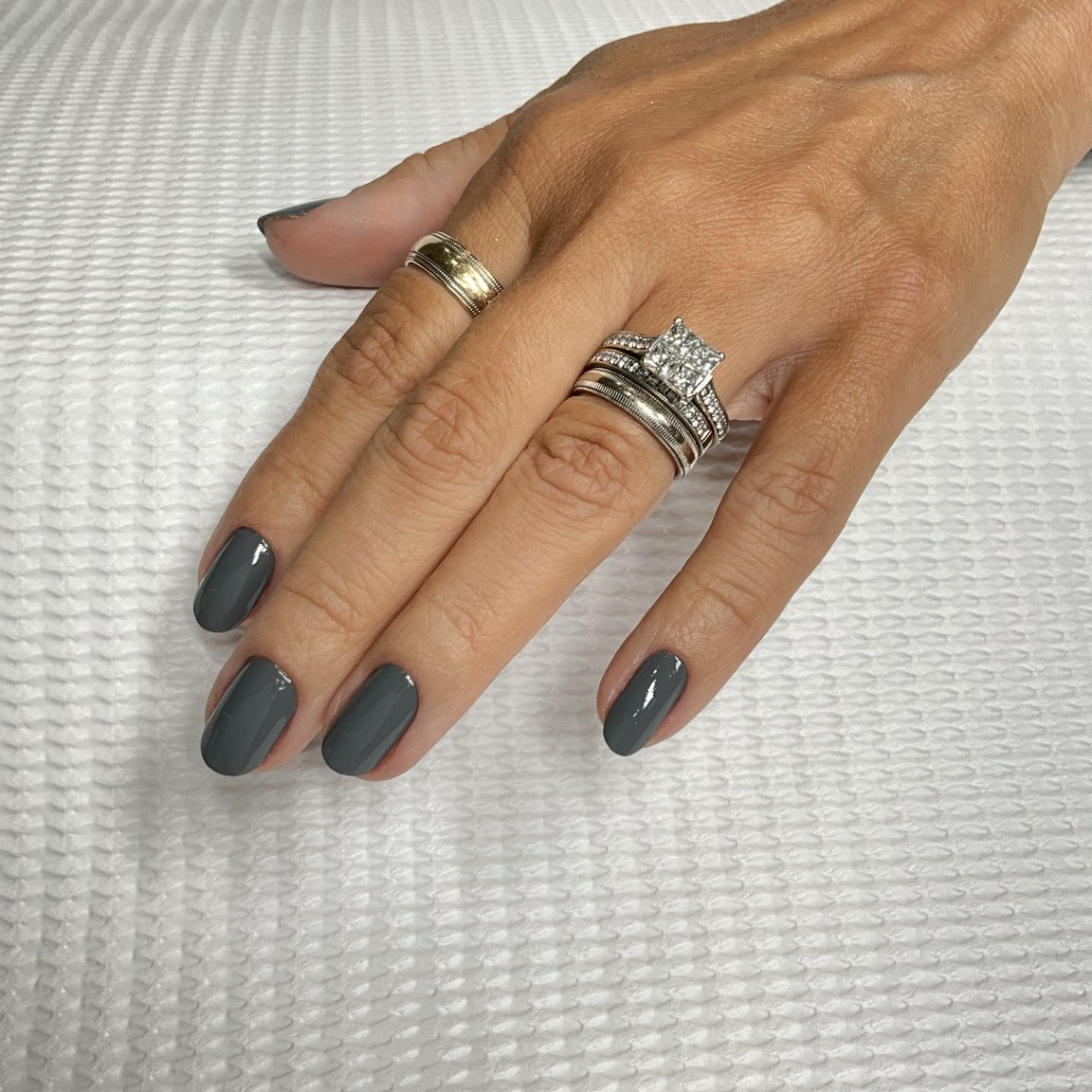 Glossy graphite gray nails with a rounded finish
