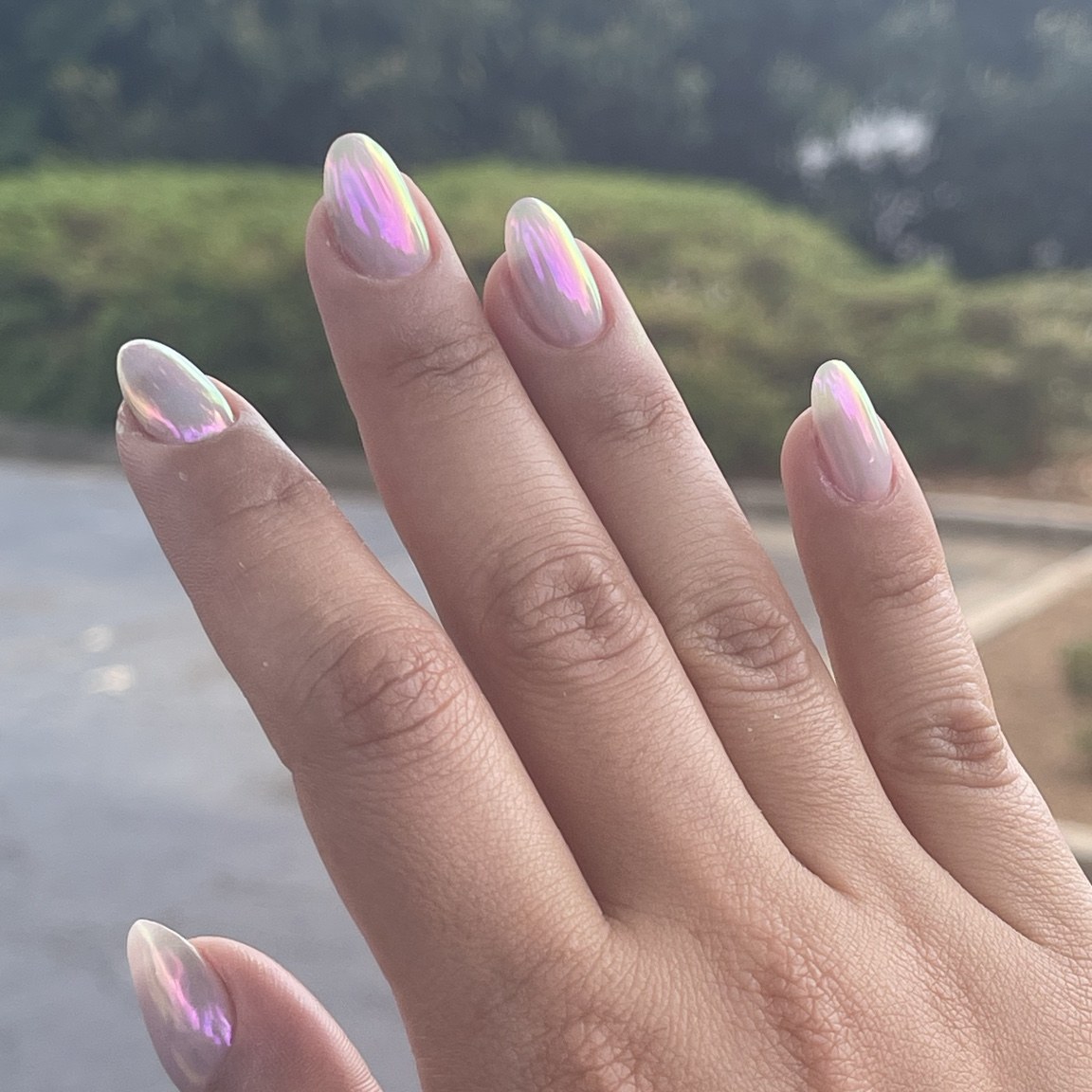 Long almond nails with an iridescent lilac and gold finish